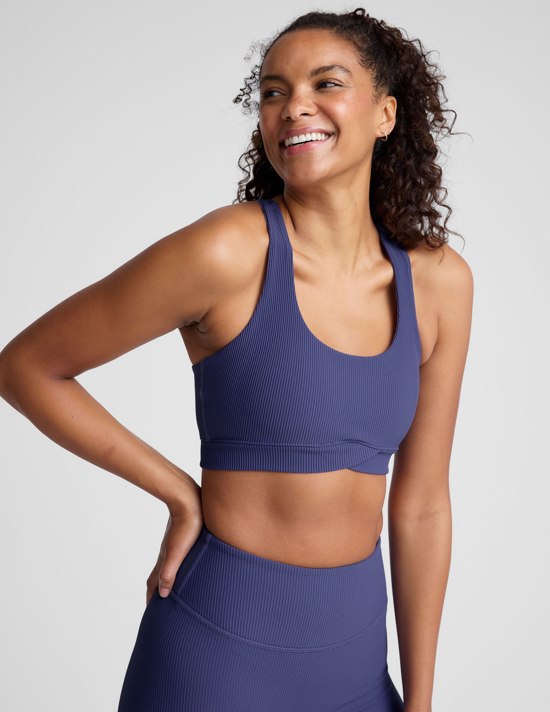 Impulse Ribbed Racerback Sports Bra with Overlap Hem and Removable Pads