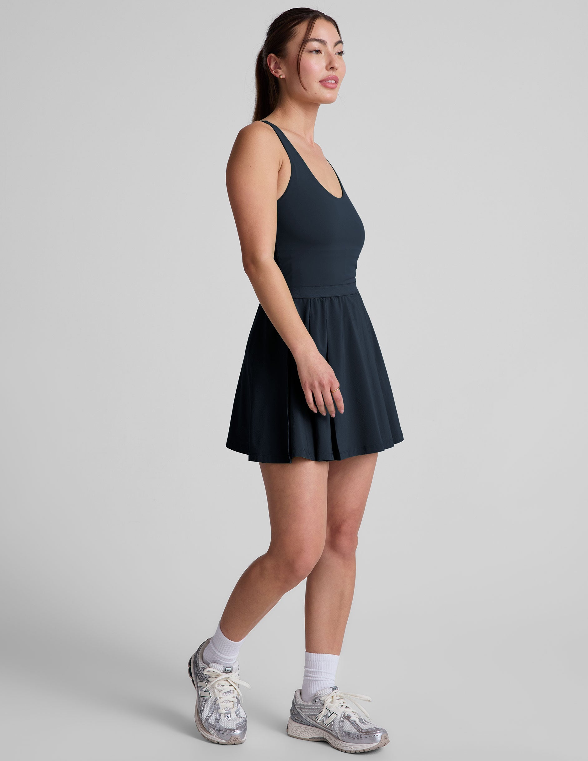 Active Pleated Mini Dress: Built-in Shorts, Pockets, Open Back Design